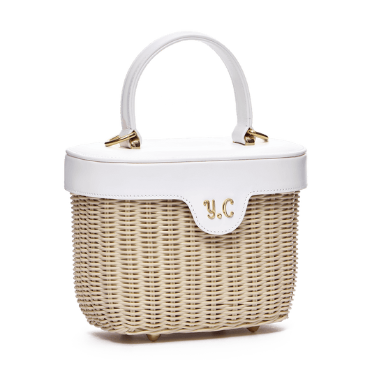 Woven basket with leather cover and floral lining
