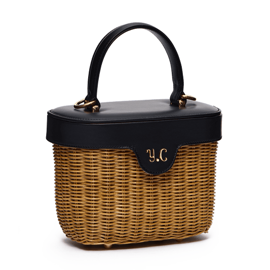 Woven basket with leather cover and floral lining