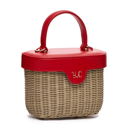 Woven basket with leather cover and floral lining