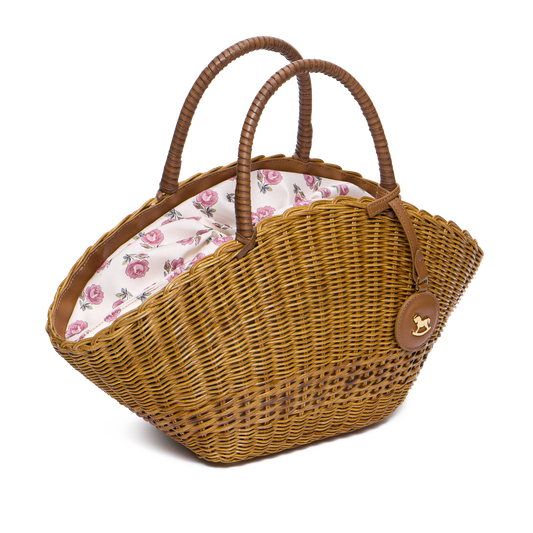 Basket bag with signature print lining and a charm