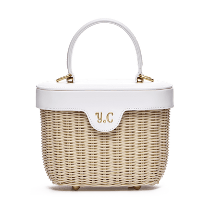 Woven basket with leather cover and floral lining