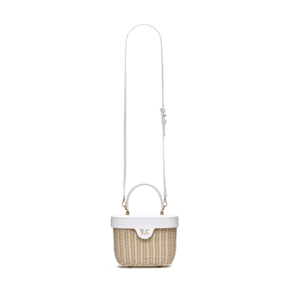 Woven basket with leather cover and floral lining