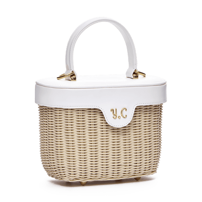 Woven basket with leather cover and floral lining