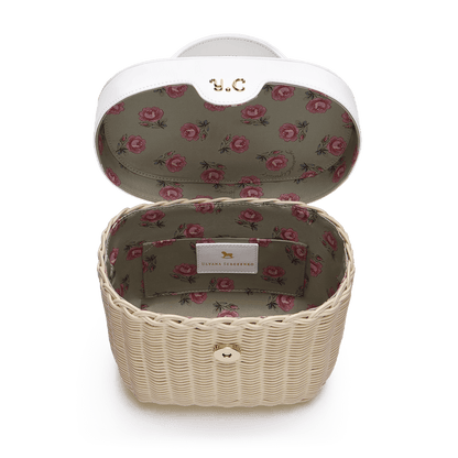 Woven basket with leather cover and floral lining