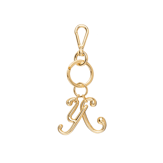 Keychain with Ulyana Sergeenko’s iconic Cyrillic “U.S.” letters