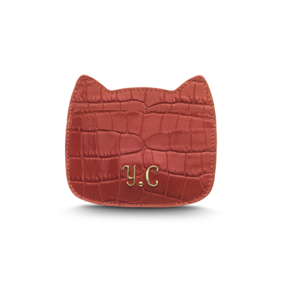Cat-shaped leather cardholder with signature “U.S.” initials